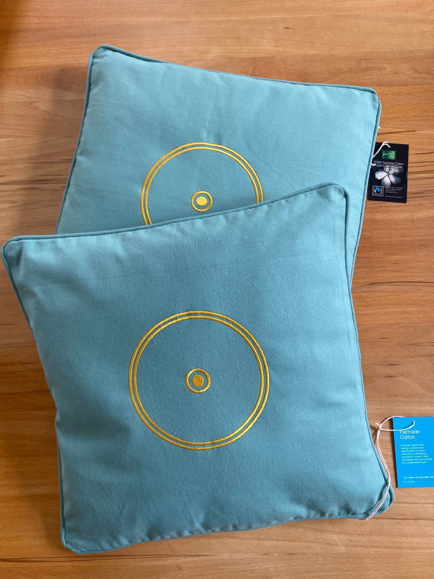 2 Orgon Kissen grün mit energetischem Schutz (Sonnensymbol) - Fairtrade.net